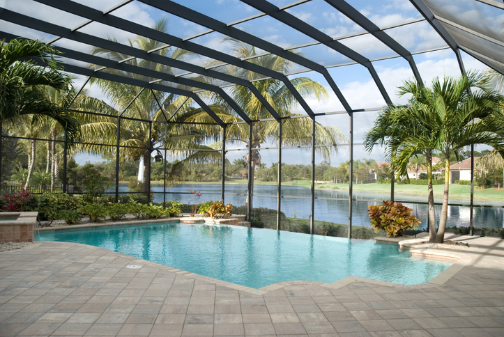 clean pool room with glass roofing